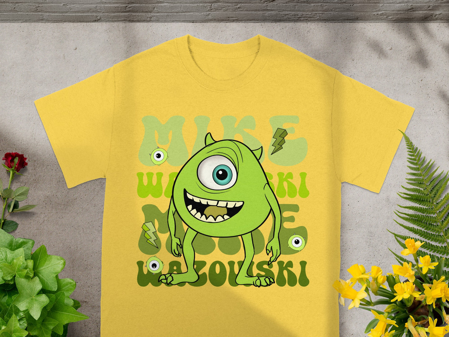Yellow t-shirt with cartoon monster character "Mike Wazowski".