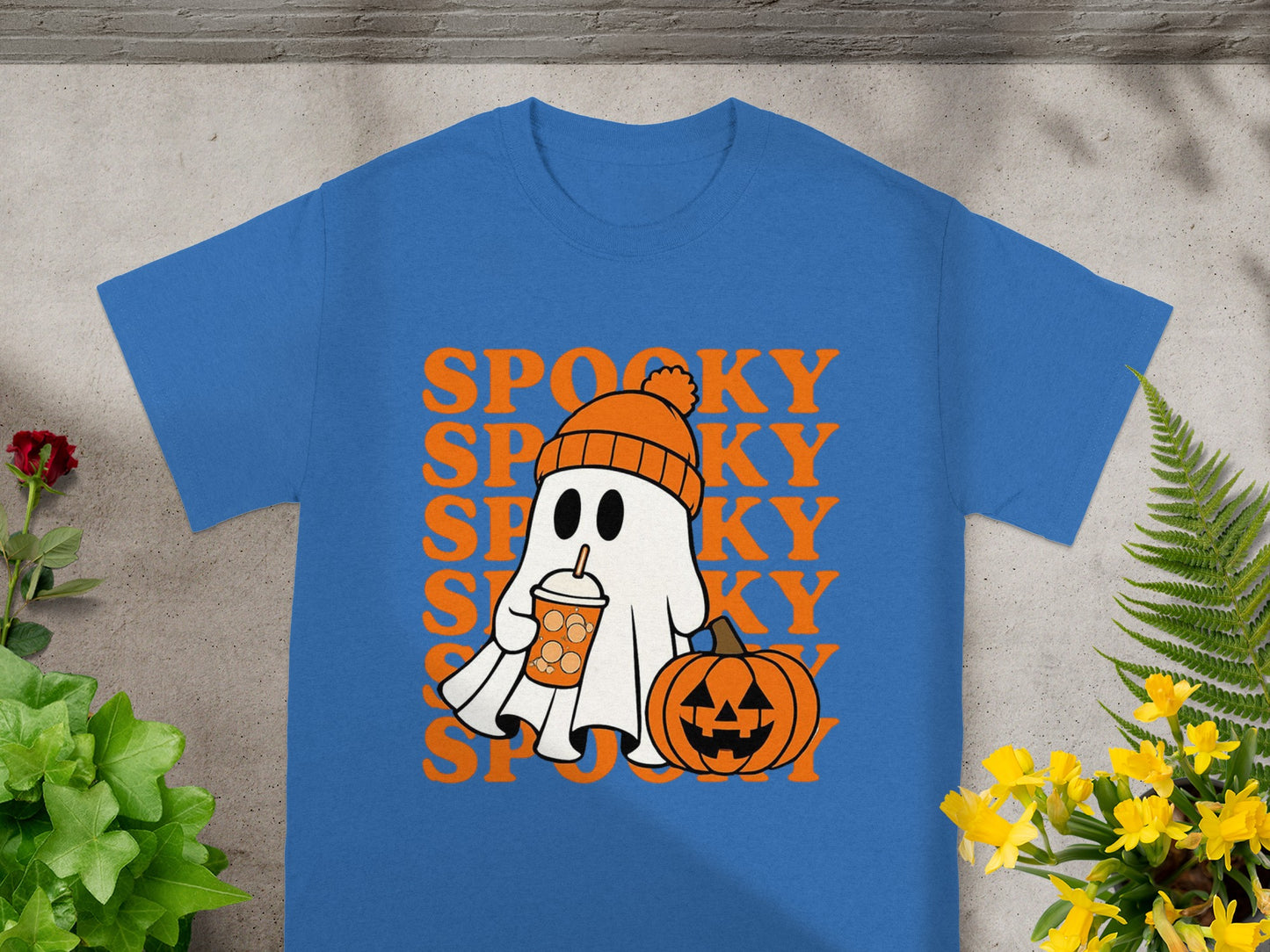 Blue t-shirt with a cartoon ghost, pumpkin, and "SPOOKY" text.