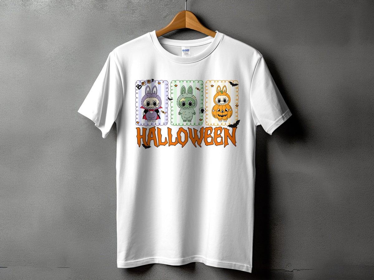 White t-shirt with Halloween graphic featuring three cartoon characters and text.