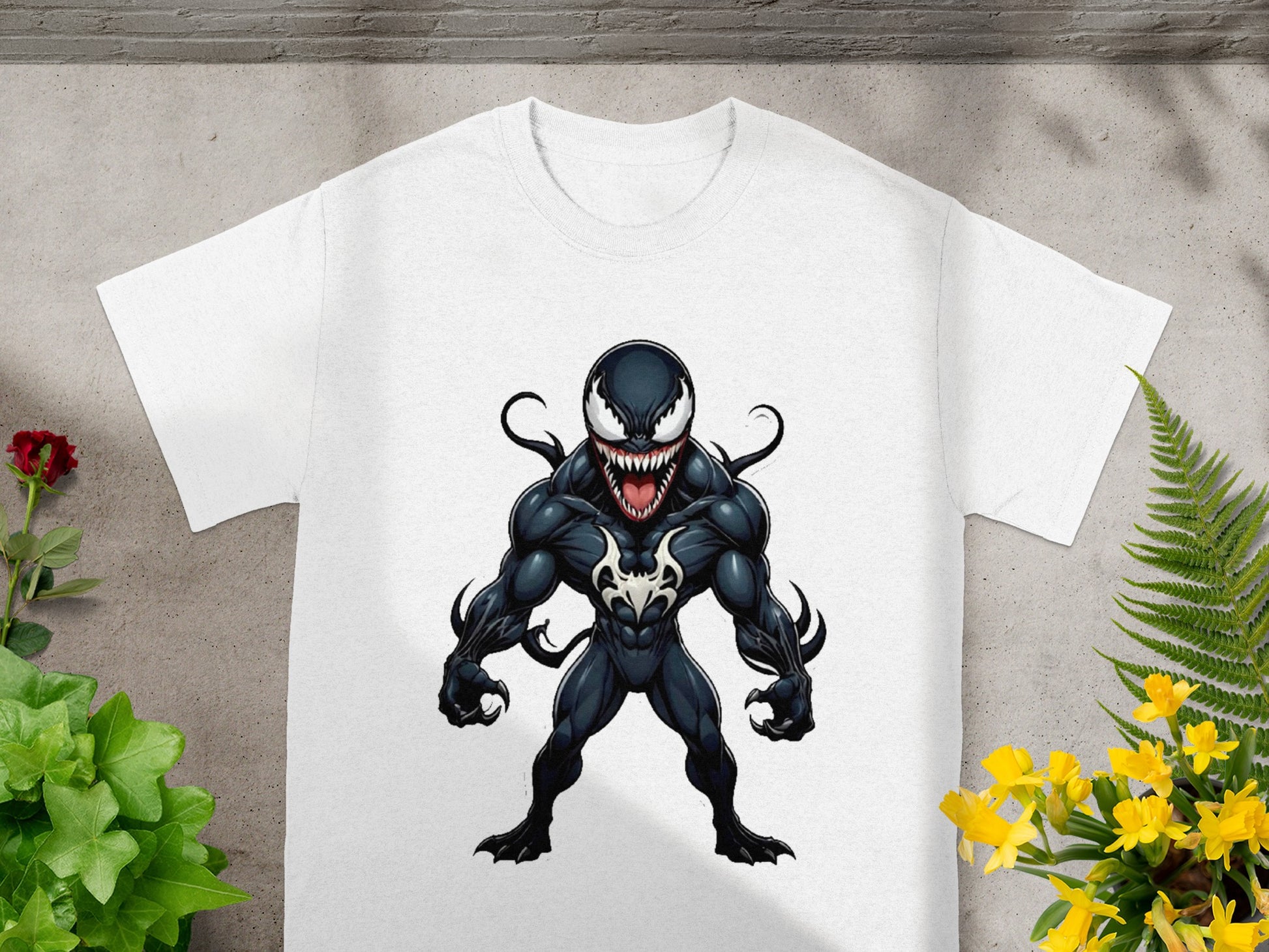 White t-shirt with black and white Venom illustration, standing front view.