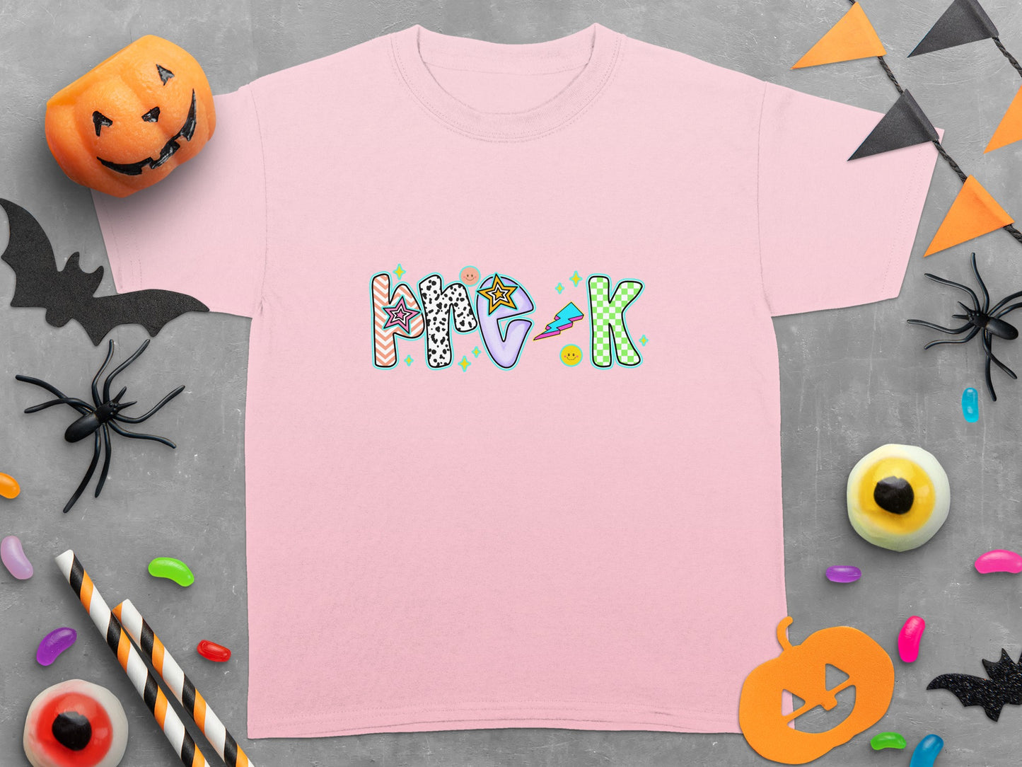 Pink t-shirt featuring "Pre-K" text with Halloween-themed decorations.