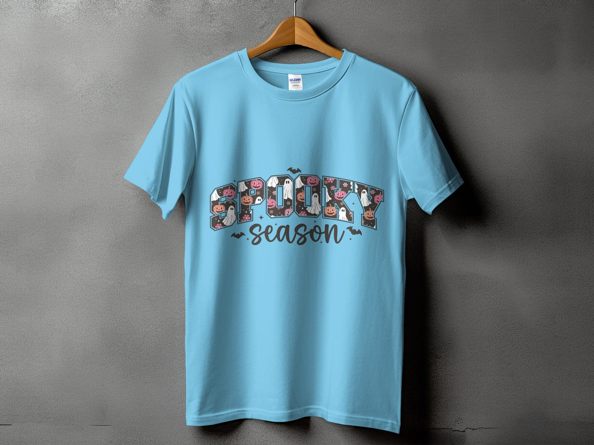 Light blue t-shirt with "Spooky Season" graphic featuring ghosts and pumpkins.