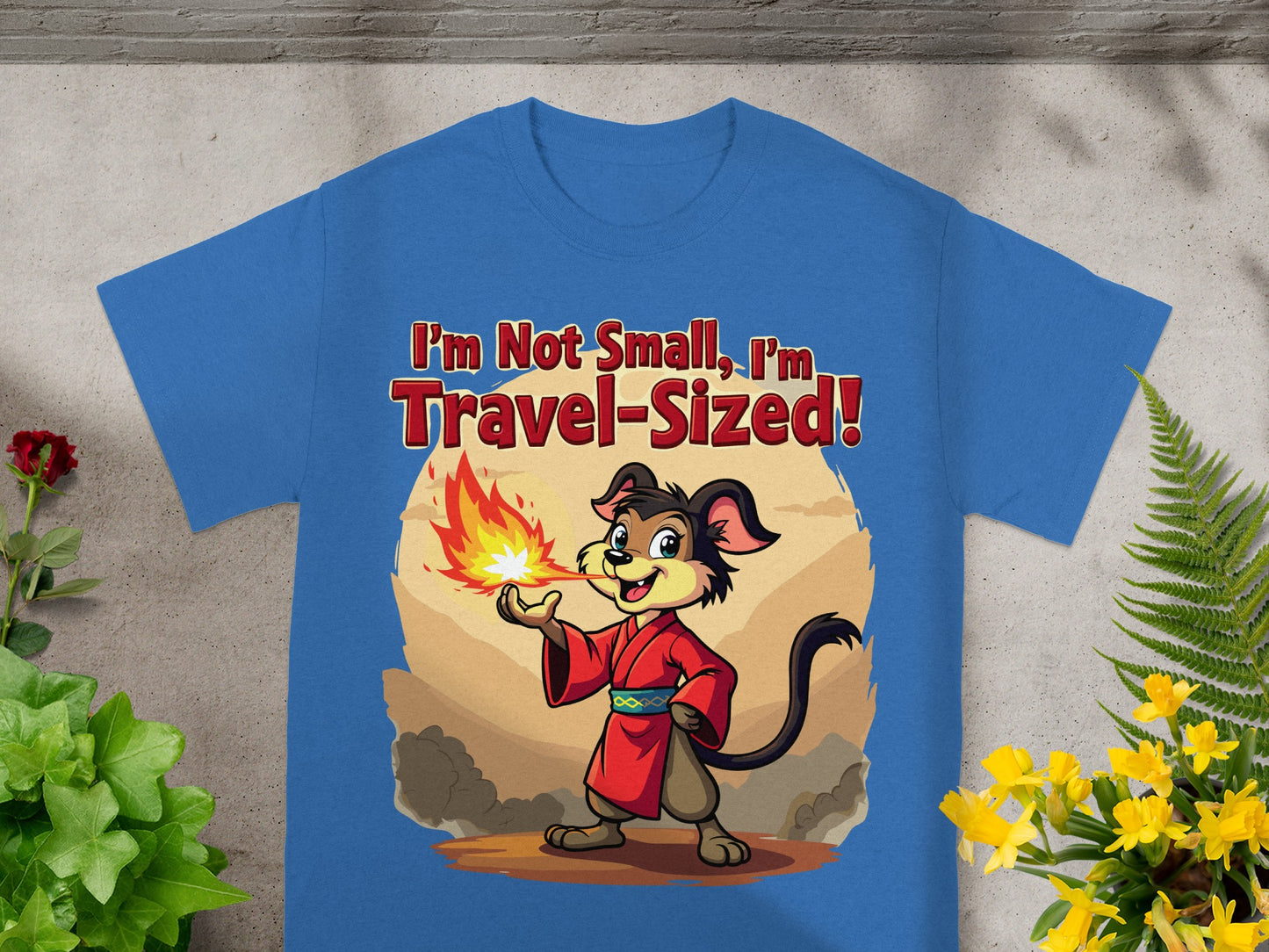 Blue t-shirt with "I'm Not Small, I'm Travel-Sized!" and a dog breathing fire.